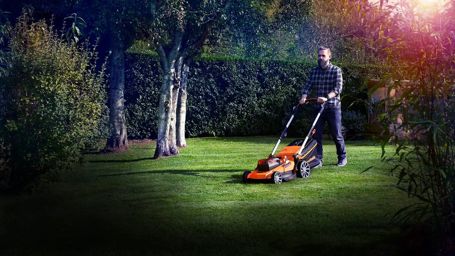 LawnMaster cordless lawnmower on large Irish garden