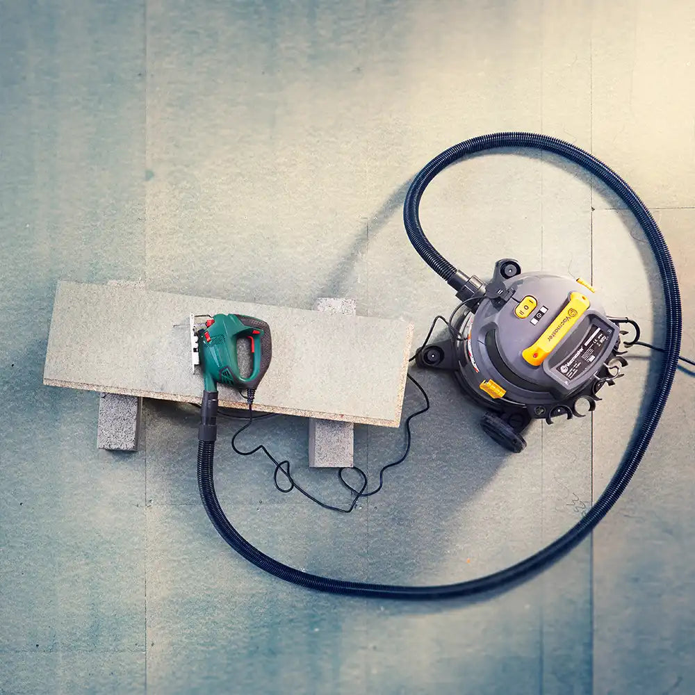 Vacmaster L20 Wet and Dry Dust Extractor connected to a power tool using Power Take Off Socket