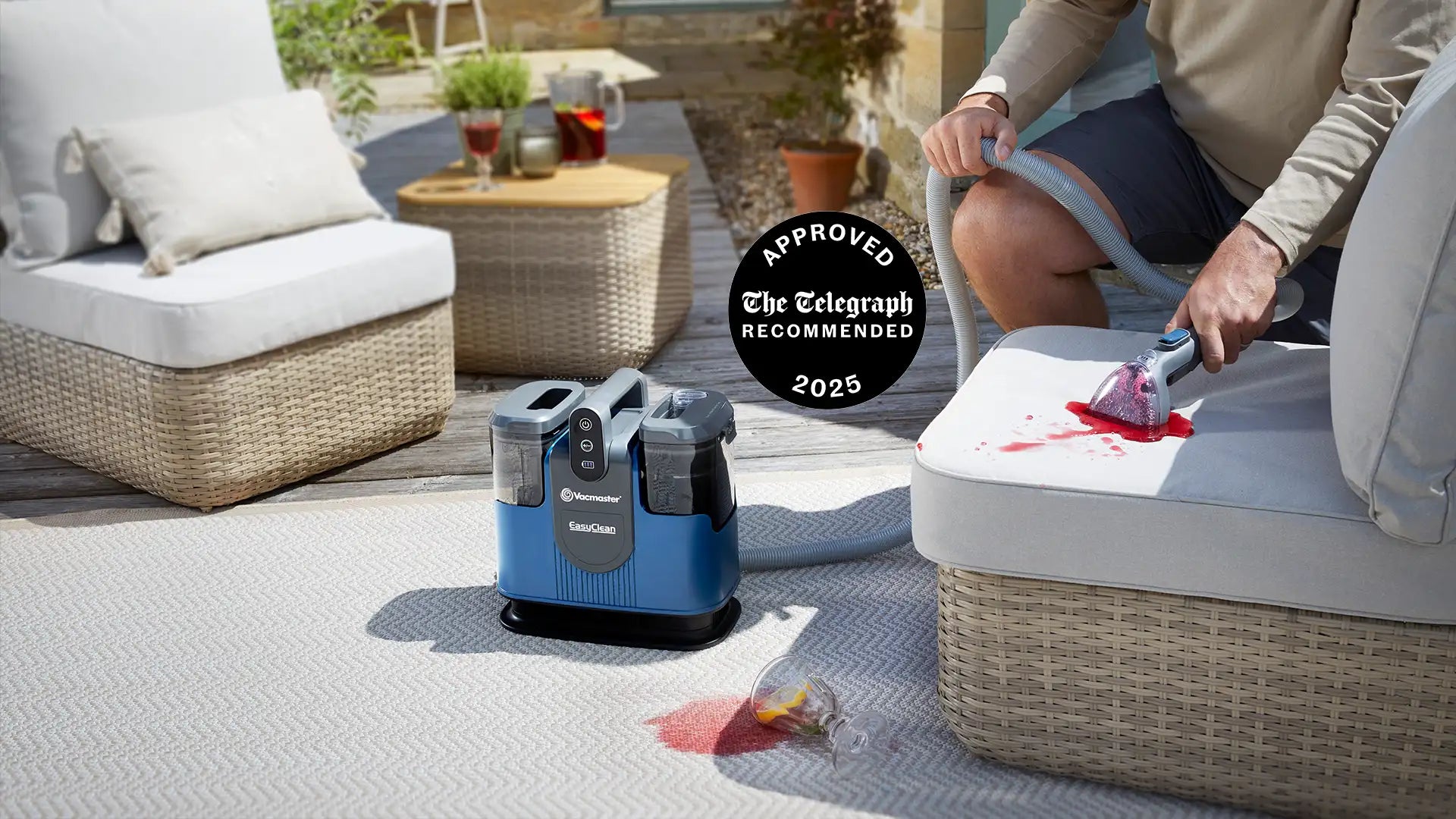 Vacmaster EasyClean Go cordless spot cleaner removing spilled drink stain from outdoor chair