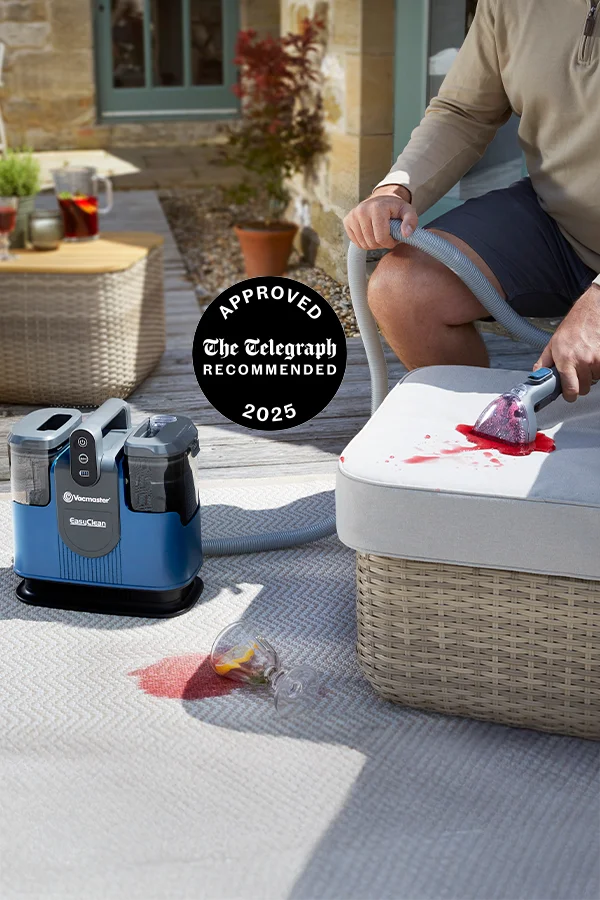 Vacmaster EasyClean Go cordless spot cleaner removing spilled drink stain from outdoor upholstery
