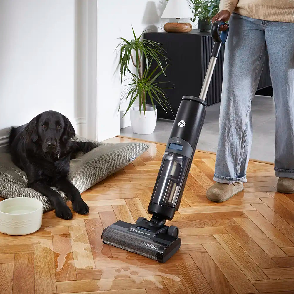 Cordless Hard Floor Cleaner HVA  from Vacmaster vacuuming up water from spilled dog water bowl HA2203UK