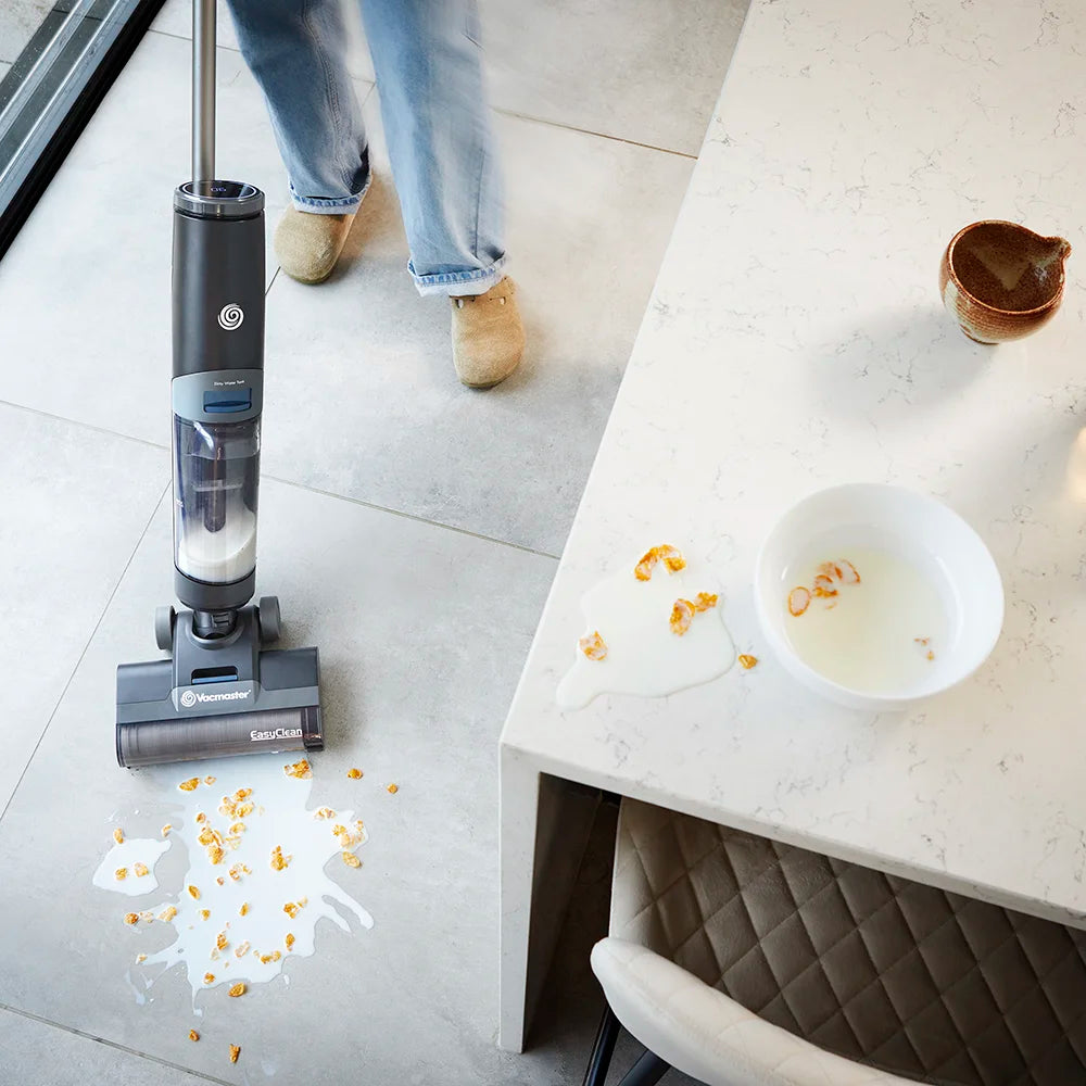 Vacmaster Hard Floor Cleaner HVA cleaning up spilled cornflakes next to kitchen island HA2203UK