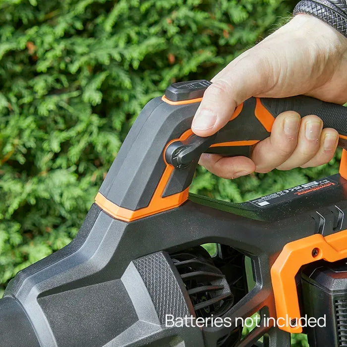Man using cruise control function on LawnMaster 48V Axial leaf blower