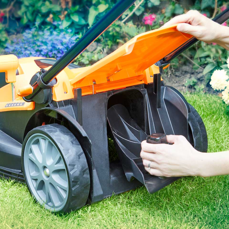 LawnMaster 24V 37cm cordless lawnmower with its mulching plug