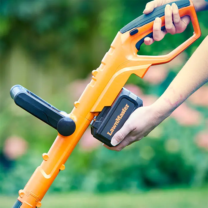 LawnMaster MX 24V Cordless Grass Trimmer in an Irish Garden