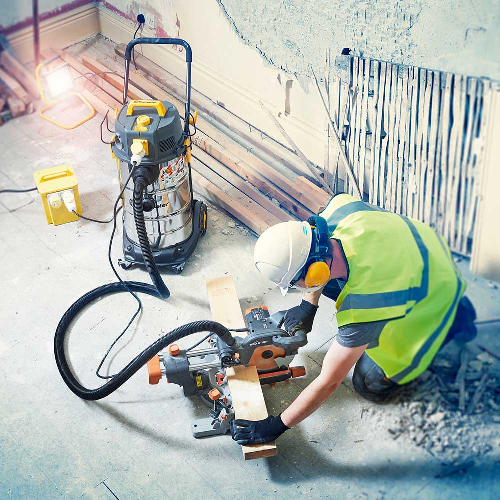 Vacmaster M38 Dust Extractor with Power Take off Socket being used by Tradesman