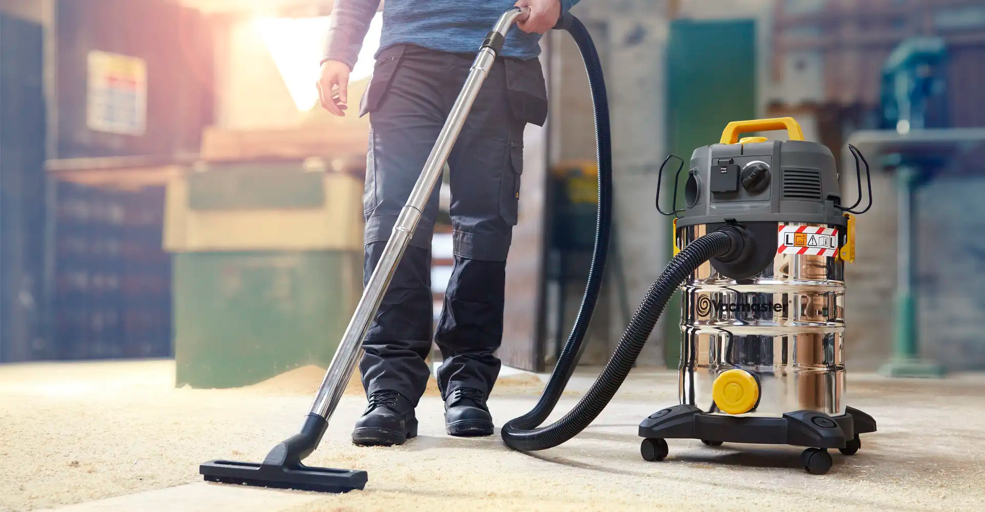 Vacmaster L Class removing dust from workshop floor