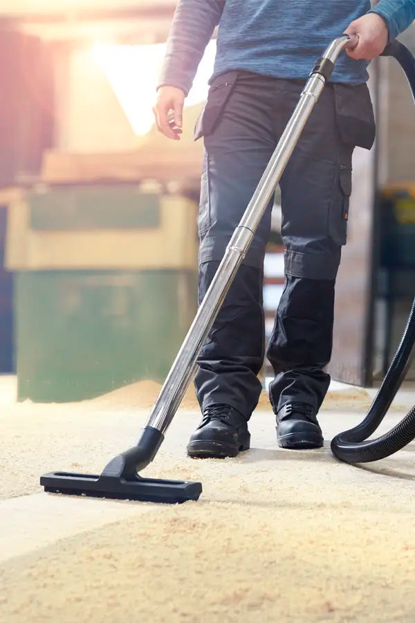 Vacmaster L Class removing dust from workshop floor